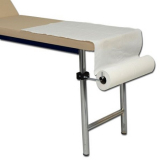 Paper roll holder for examination couch