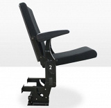 Armchair with synchronic folding of the seat and armrest